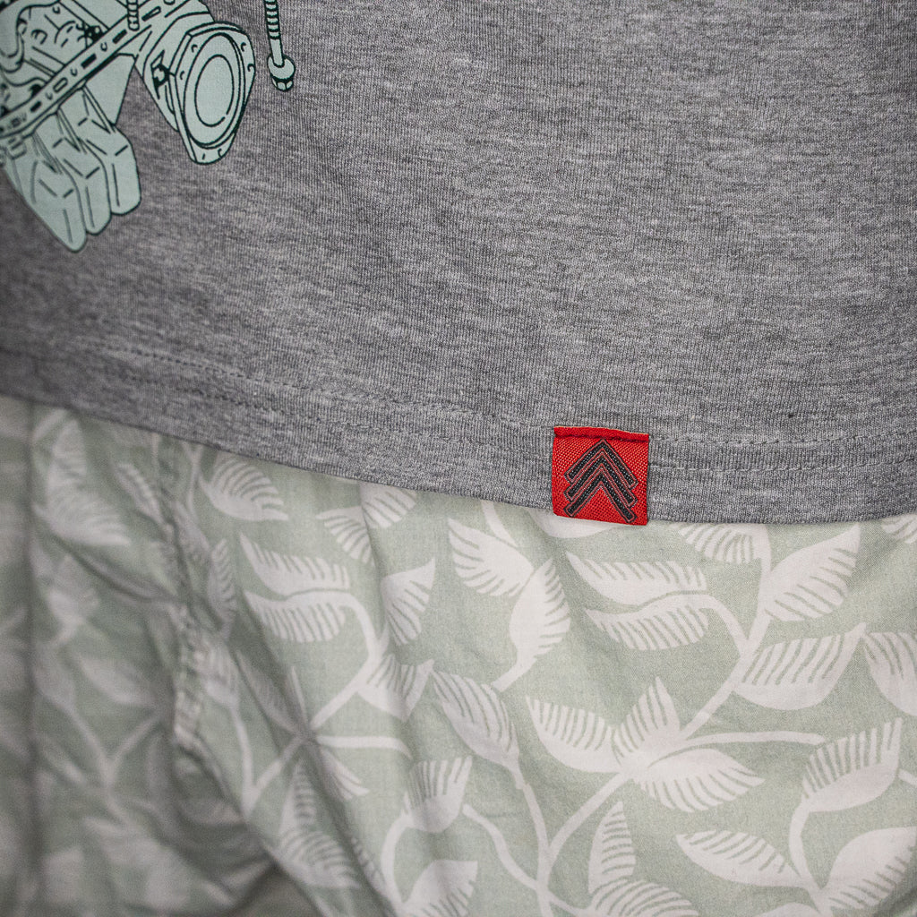 Level UP Nissan RB26 engine diagram T-shirt in grey with close up detail on Level UP red tag sewn onto front hem