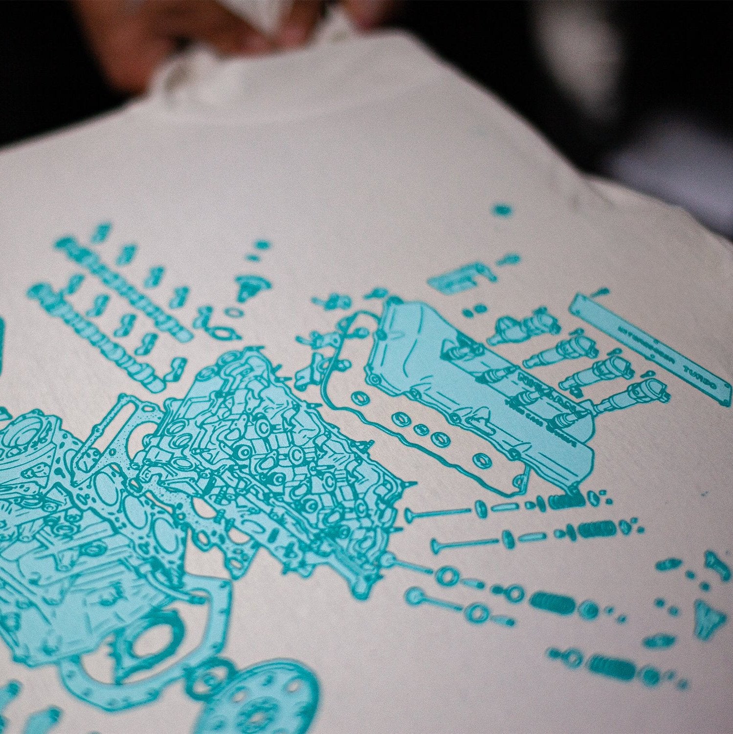 Close up of LVL UP Nissan SR20 engine diagram T-shirt showing details of intricate, screen printed artwork