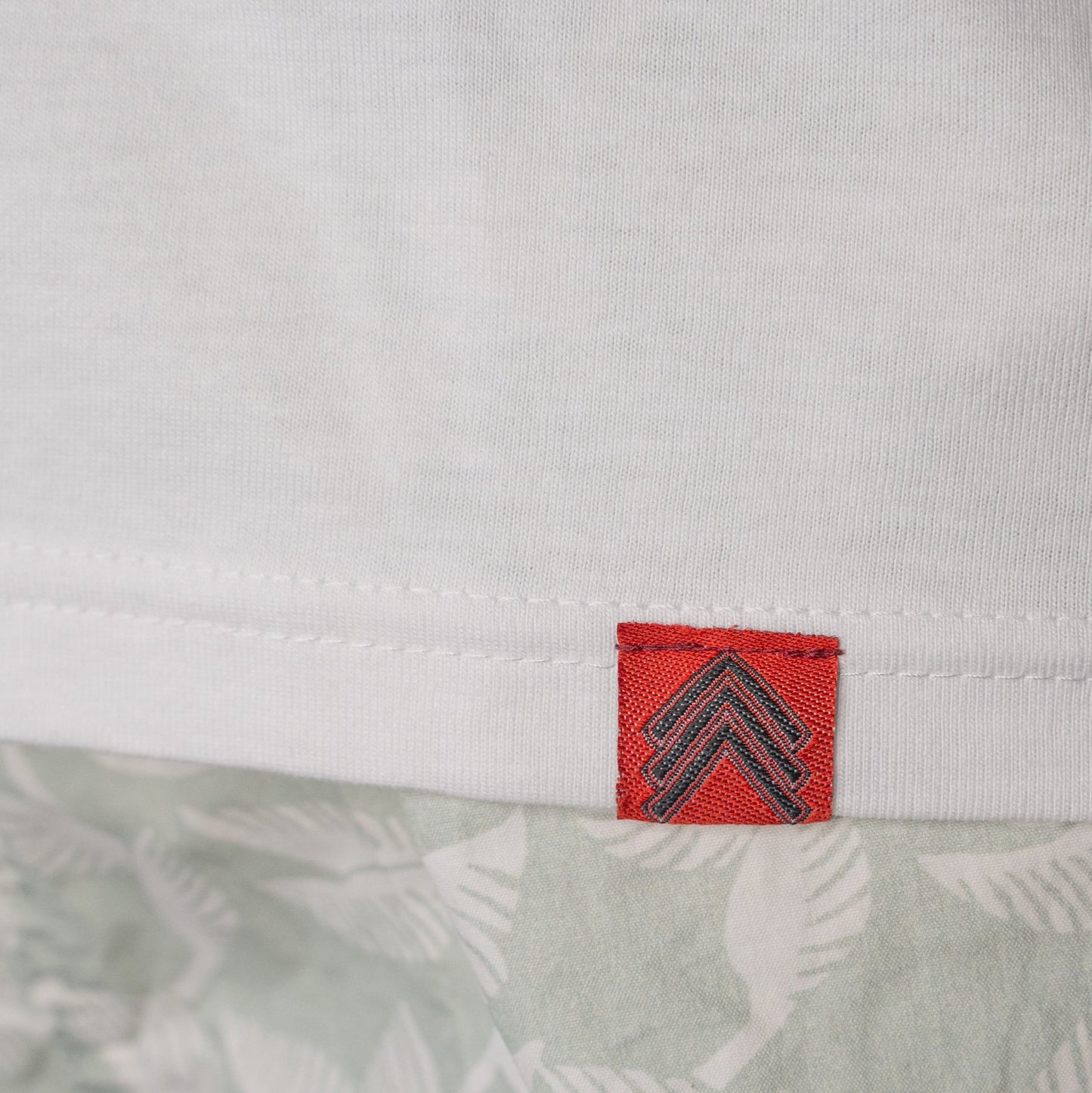 Level UP Nissan SR20 engine diagram T-shirt in white showing red Level UP tag stitched into the hem from the front