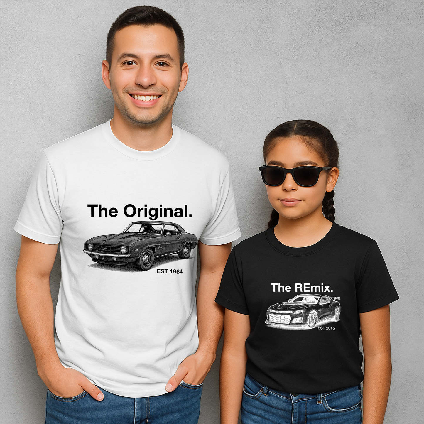Dad and daughter in matching car shirts – The Original first-gen Camaro and The Remix sixth-gen Camaro designs on white and black tees